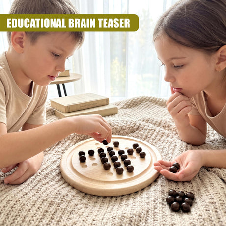 Two children play with a wooden solitaire board and dark circular tokens.