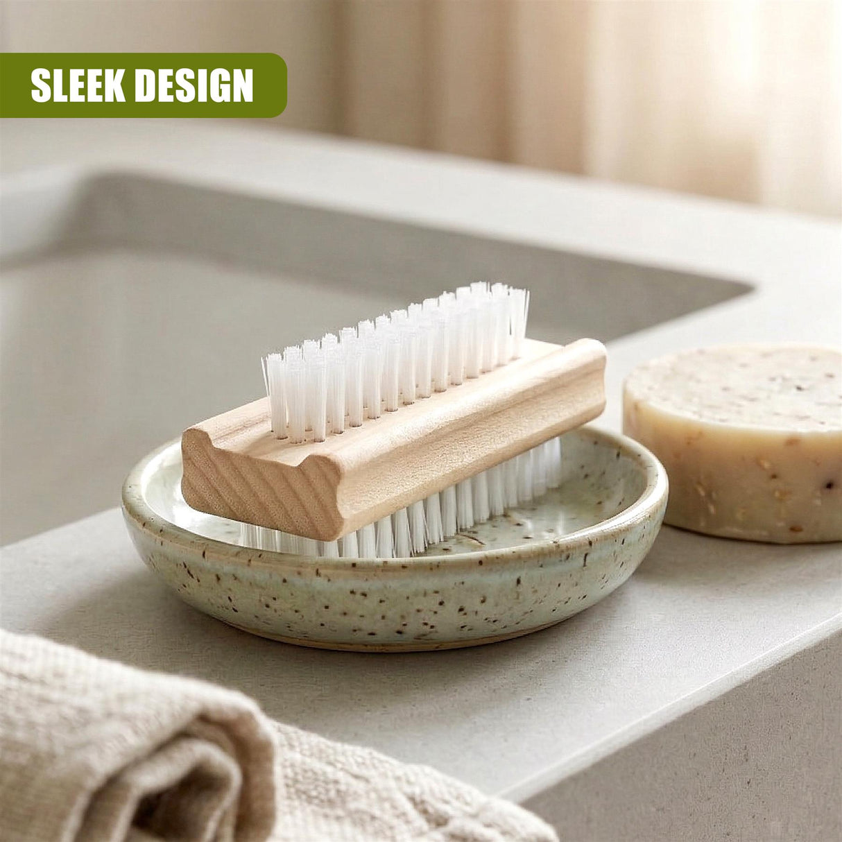 Wooden nail scrubbing brushes are displayed in a speckled ceramic dish with soap nearby.