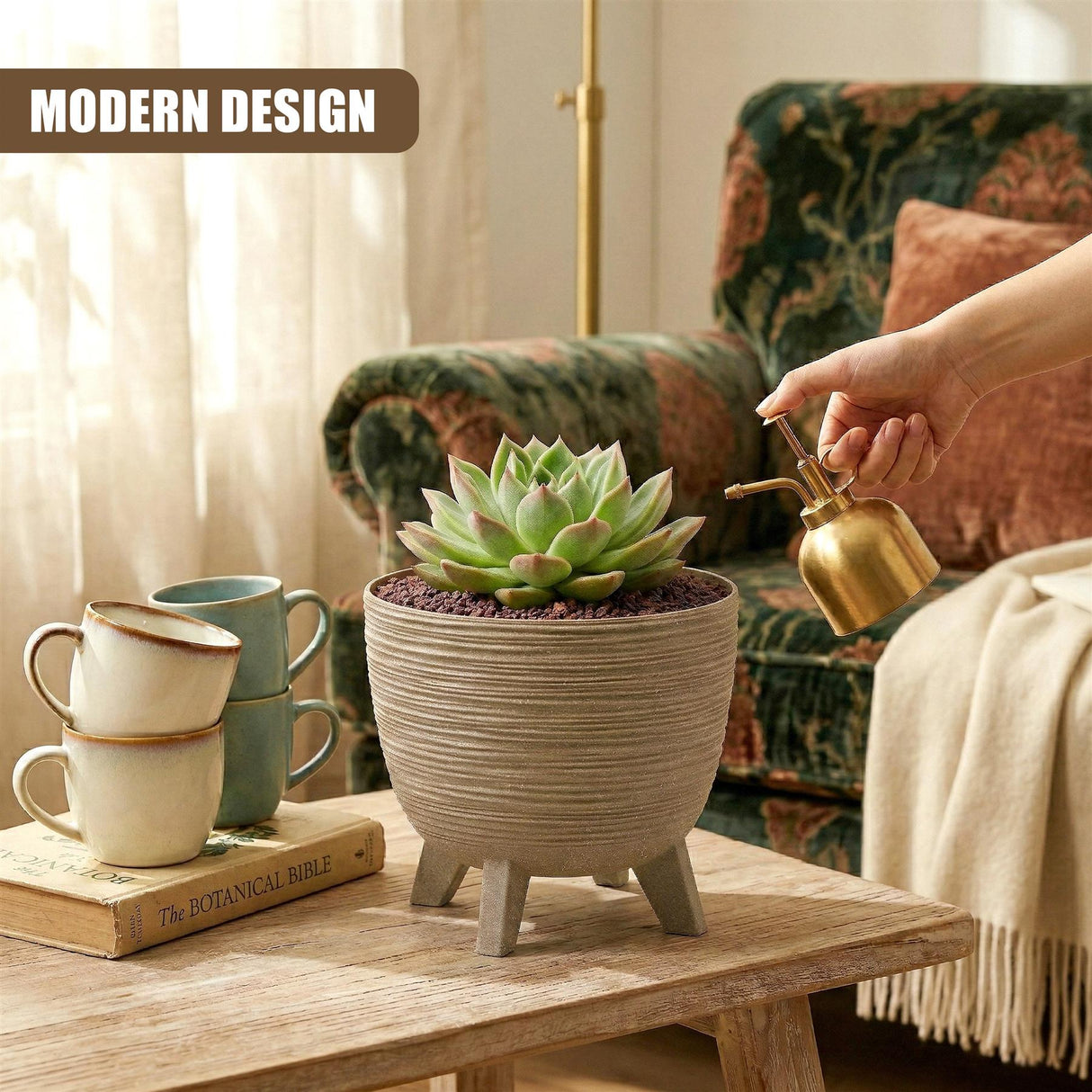 Ceramic planter pot on short legs holding a green succulent, displayed on a light wooden table surface.