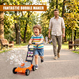A child pushes an orange bubble machine while an adult walks down a tree-lined path in a park.