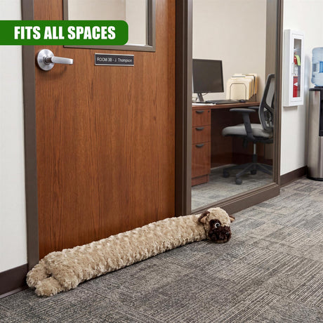 A plush, brown dog draught excluder rests on the carpet near a paneled wooden interior door.