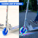 Blue scooter with illuminated wheels shown both stationary and moving outdoors.