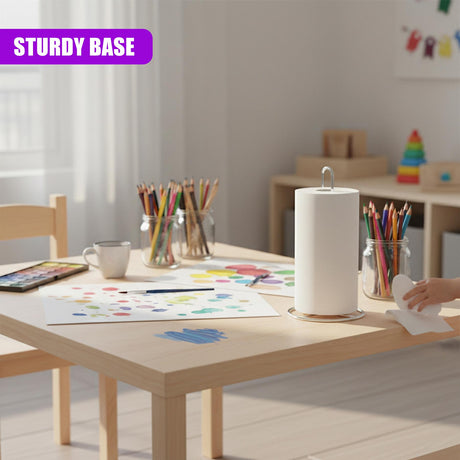 Cylindrical white kitchen roll stand with a metal base sits on a light wooden table surface.