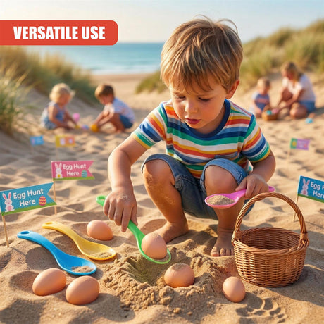 A boy interacts with colored spoons and several scattered painted eggs on the sand.