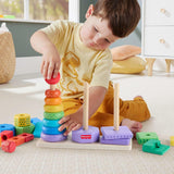 Colorful wooden stacking rings, blocks, and a shape sorting base rest on a light colored surface.