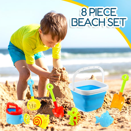 A set of beach toys on a sandy beach, ready for playtime.