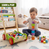 Wooden baby walker, stacked colored blocks, and loose toy blocks are visible on the floor.