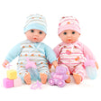 Two baby dolls and various accessories including blocks and toys.