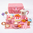 A tea party set including a picnic basket, teapot, teacups, miniature treats, and a teddy bear.