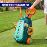 A teal golf cart set with two clubs stands on a green outdoor lawn.