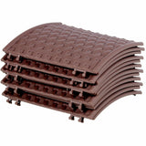 A stack of brown plastic Christmas tree skirt panels featuring a woven texture and interlocking edges