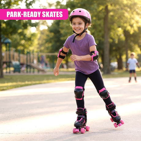 A smiling girl wearing a pink helmet and protective gear skates on quad roller skates in a park