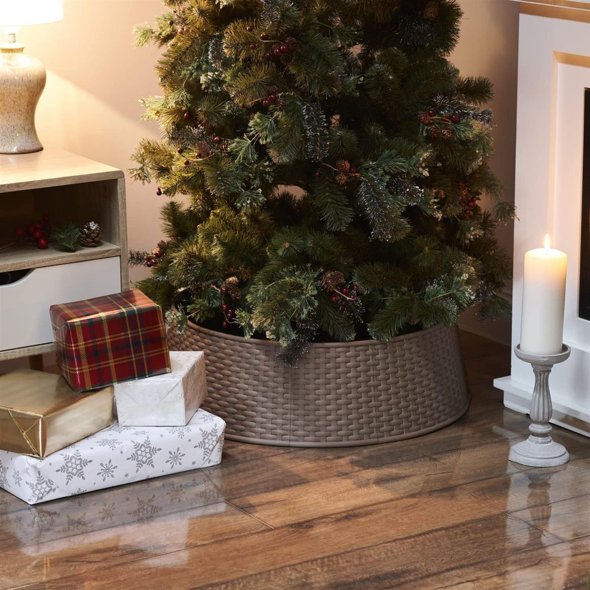 Brown Christmas tree skirt with woven texture under a decorated tree and wrapped gifts on wooden floor