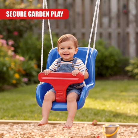 A smiling toddler wearing denim dungarees and a striped shirt sits on a blue plastic swing seat with red safety bars