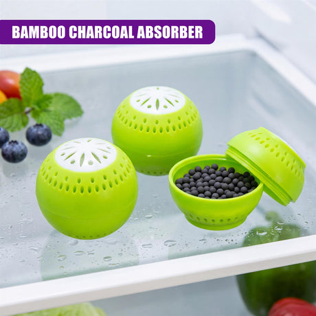 A set of three green charcoal absorbers rests on a refrigerator surface with produce.