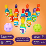 Colorful plastic bowling set featuring numbered pins and purple and green balls.