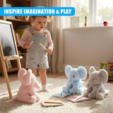 Blue elephant plush toy on a white rug, with two children and a parent. A child sits behind the elephant, another stands in front of it, all looking at the camera with a soft focus. - UKBuyZone