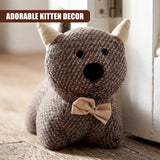 Knitted stuffed kitten door stopper is brown yarn with ears and a beige bow tie.