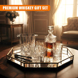 Set of four glasses, an ice bucket, a decanter, and bar tools displayed on a metal tray.