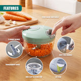 Manual food chopper showing a clear bowl, pull handle, and silicone base pad for chopping ingredients.