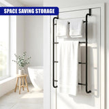 A black towel rail hangs on a white door, holding multiple white towels for storage.