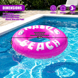 An inflatable pink beach float rests in a swimming pool, featuring printed text and dimension measurements.
