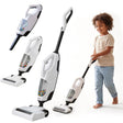 Multiple models of kid-sized Hoover vacuum cleaners displayed alongside a boy using one.