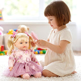Little girl brushing the blonde hair of a large doll dressed in a pink and floral patterned outfit.