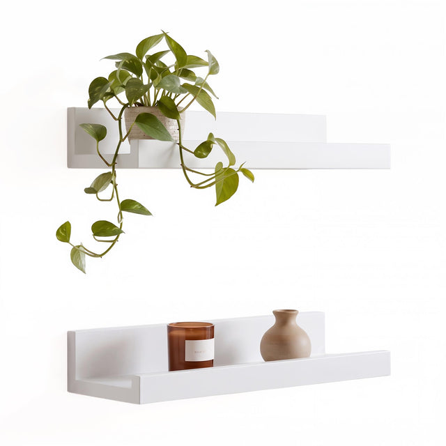 White wall hanging shelf pack of two from GEEZY displaying a plant and candle