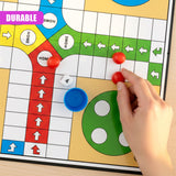 A hand places a red playing piece on the Ludo board near the central starting area.