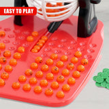 Red bingo game board features numbered red and orange plastic tokens.
