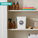 Shelf display featuring a washing machine, soap dispensers, and laundry accessories.