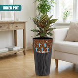 Dark gray ribbed flower pot displaying blue arrow graphics, holding a lush indoor plant.