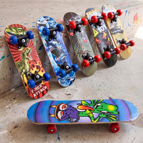 Multiple colorful skateboards featuring various graphics are displayed on a textured concrete surface.