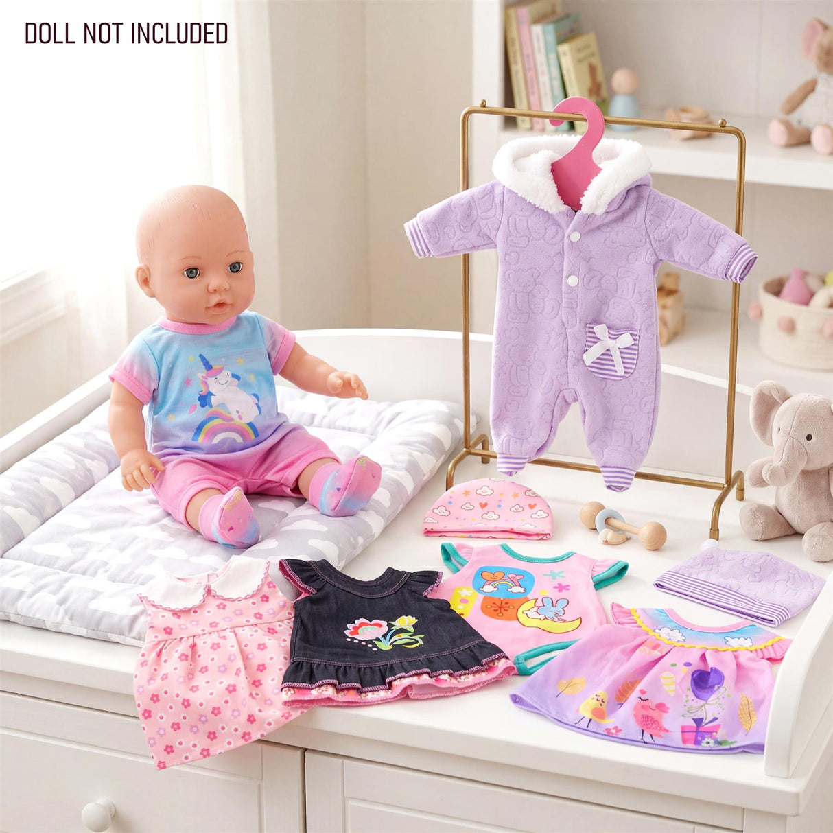 The image displays six doll outfits, including pink dresses and a lavender cardigan, arranged on a white dresser.