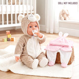 Doll wearing a bear costume and a pink bunny outfit set displayed in a small woven basket.