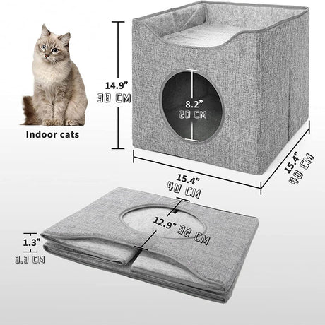 Grey cat house with a black circular opening, displayed next to a measuring tape and a small white cat sitting inside it. - UKBuyZone