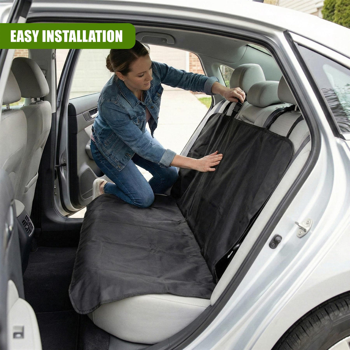 "Person installing car seat cover, showcasing use with trunk open, emphasizing protection and easy installation." - UKBuyZone
