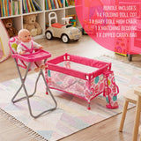 Pink foldable high chair and coordinating cot set are displayed on a rug near toys.
