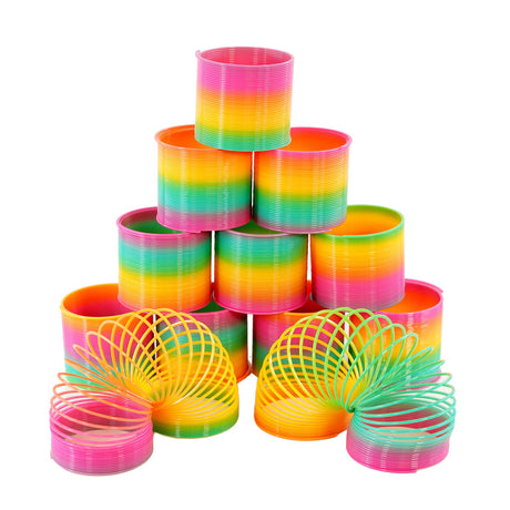 A set of colorful, flexible, and fun Slinky-like toys in various sizes and colors, including pink, green, yellow, and blue, with a focus on their unique, coiled, and curved shape. - UKBuyZone