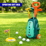 Golf clubs stored in a green cart are displayed with a tee and several white balls on grass.