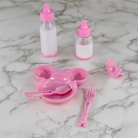 Miniature pink doll feeding set with bottles, bowl, spoon, fork, and pacifier accessories.