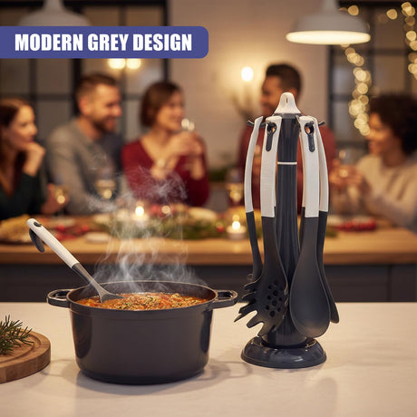 A steaming pot sits beside a stand holding assorted kitchen utensils and spatulas.