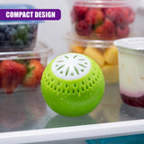 Green deodorizer ball with white lattice pattern rests on a surface near containers of snacks.