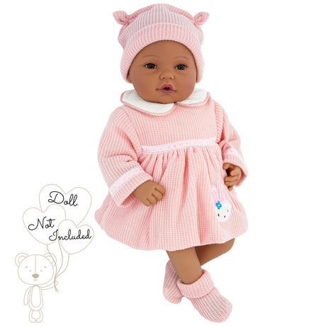 Doll wearing a soft pink knit hat and a coordinating pink crocheted dress outfit.