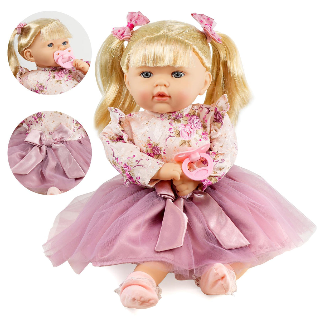 A cute baby doll with long hair in a pink dress sitting on the floor.