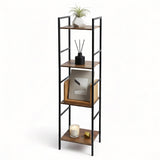 Four-tiered black metal shelving unit with wood shelves holding decorative objects, art, and plants.
