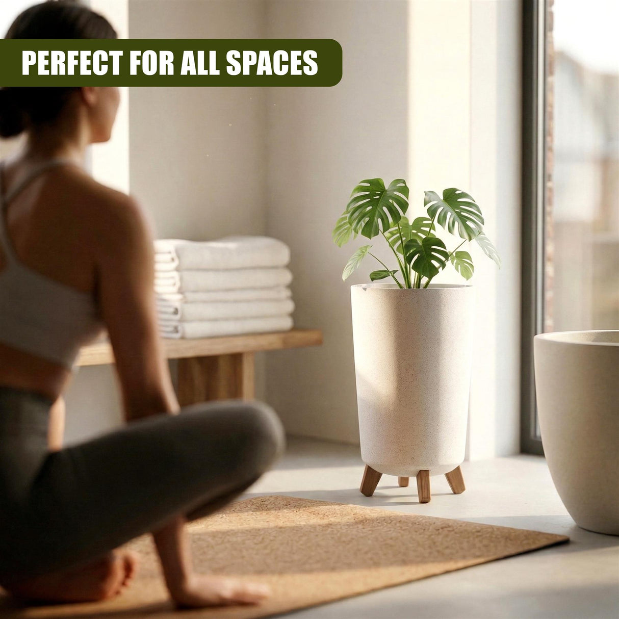 Tall cream flower pot with wooden legs displaying a vibrant leafy green houseplant.