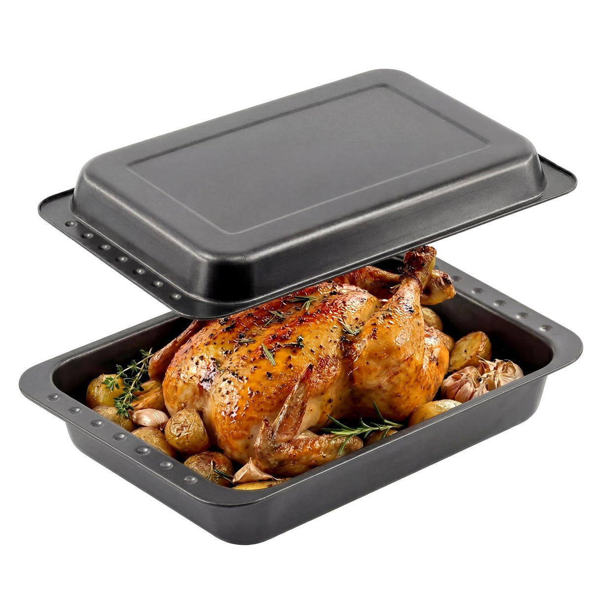 A black roasting tin set holding a roasted chicken and vegetables, covered by a lid.