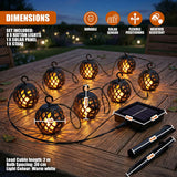 Woven rattan spherical string lights and attached solar panel displayed on a wooden surface.